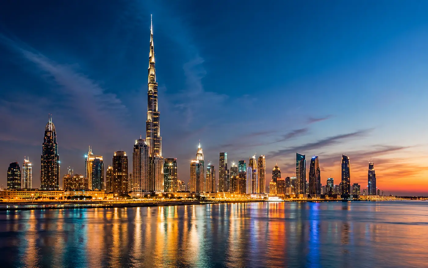Dubai skyline at dusk with the Burj Khalifa lit up